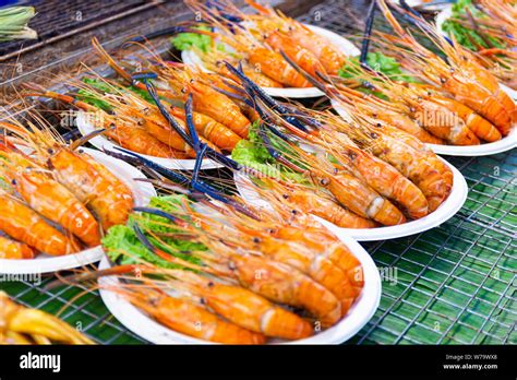 Grilled shrimps of seafood Street food of Thailand on the table in ...