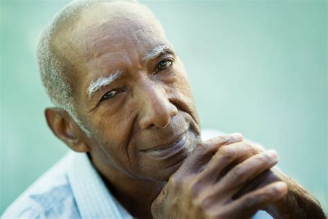 Closeup of happy old black man smiling at camera