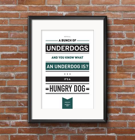 a framed poster on a brick wall with the words,'a bunch of underdogs ...