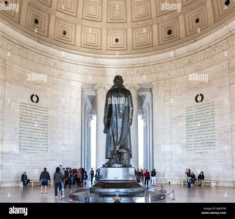 Jefferson Memorial. Visitors round the statue of Thomas Jefferson in ...