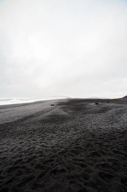 Premium Photo | Beautiful volcanic black sand beach in dyrholaey, iceland.