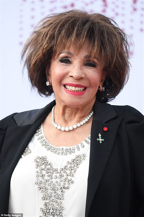 Dame Shirley Bassey, 84, is chic in a black trouser suit at the Red ...