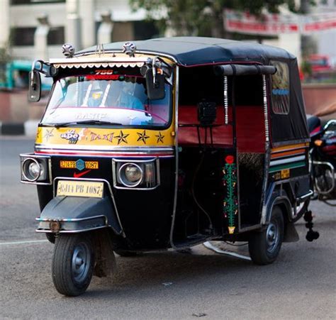 Indian rickshaw taxi. When I was in India, I loved seeing the buses ...