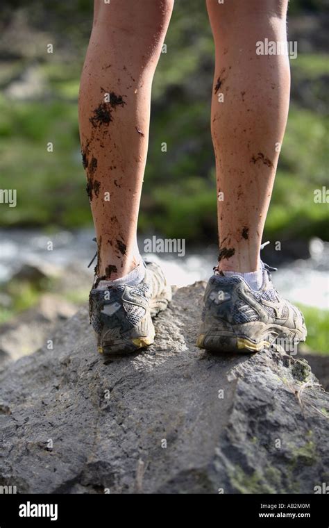 Hikers legs with mud splattering Stock Photo - Alamy