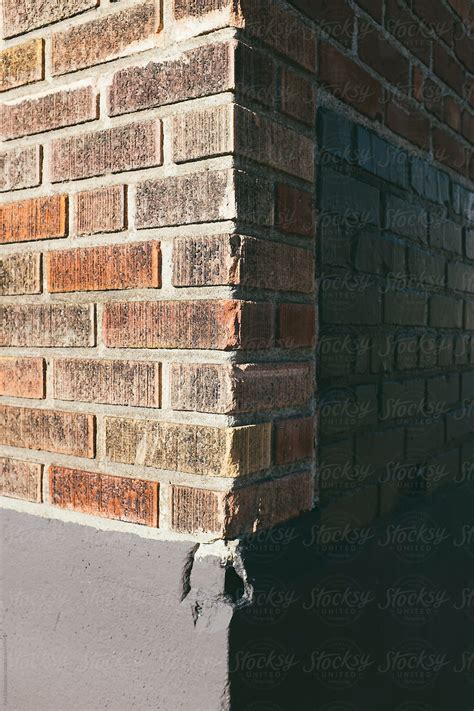 "Corner Of Brick Wall On Building Exterior, Casting Shadow" by Stocksy ...