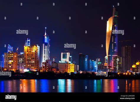 Kuwait City skyline lit up at night Stock Photo - Alamy