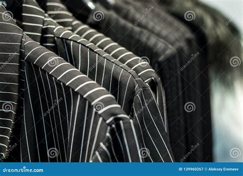 Black and White Clothes Hanging on Store Racks Stock Image - Image of ...