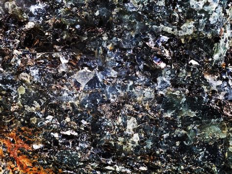 Premium Photo | Rock with crystal and metallic inclusions