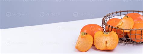 Fresh beautiful sliced sweet persimmon kaki isolated on white kitchen ...