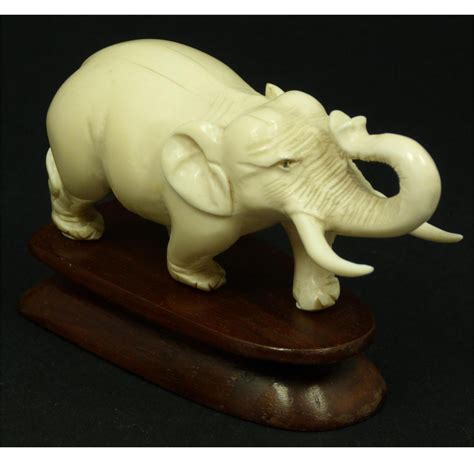 ANTIQUE HAND CARVED IVORY ELEPHANT