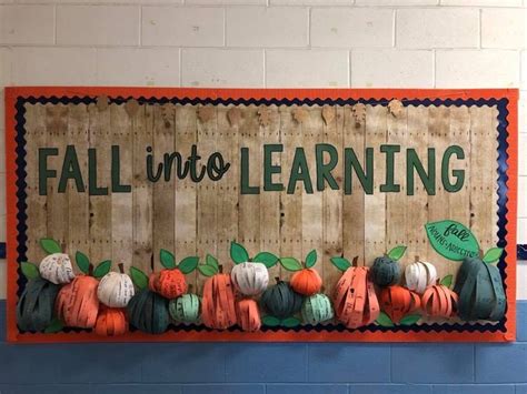 a wooden sign that says fall into learning with pumpkins and leaves on ...