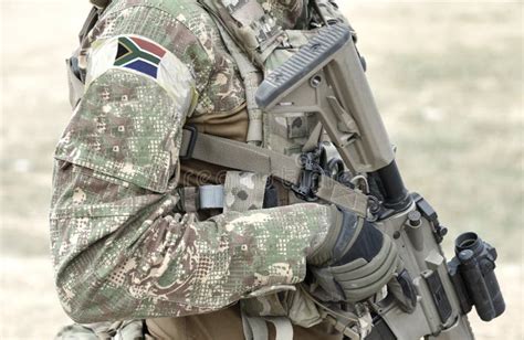 Soldier with Assault Rifle and Flag of South Africa on Military Uniform ...