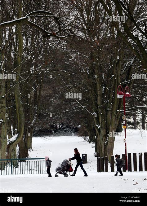 Woman and children walk through the peoples park in ballymena hi-res ...