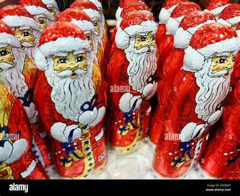 The numerous colorfully wrapped chocolate Santas in a supermarket for ...