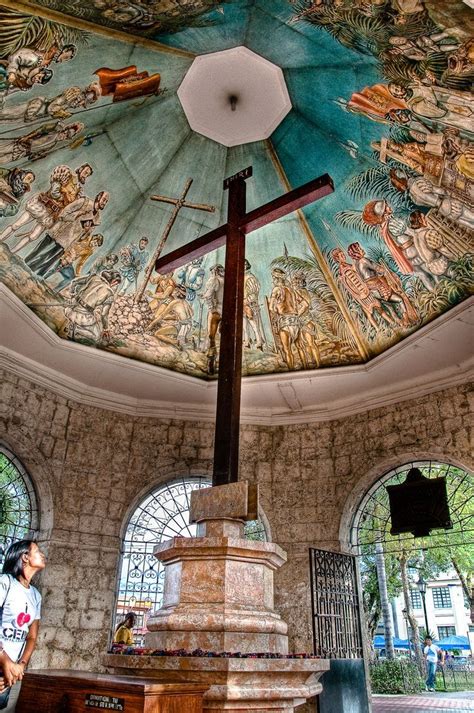 ...have a picture taken in front of the historical Magellan's Cross ...