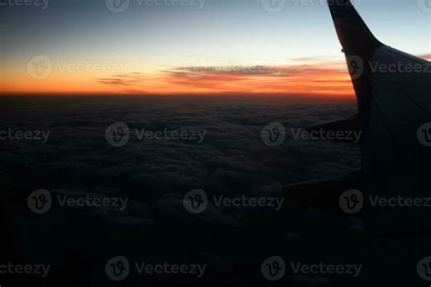 mysterious sunset with clouds from the airplane window with 32695398 ...