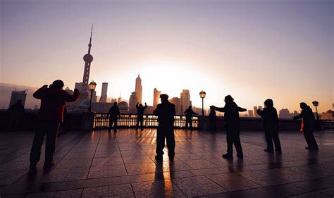 Exercising at sunrise in Shanghai. | Premium Photo - rawpixel