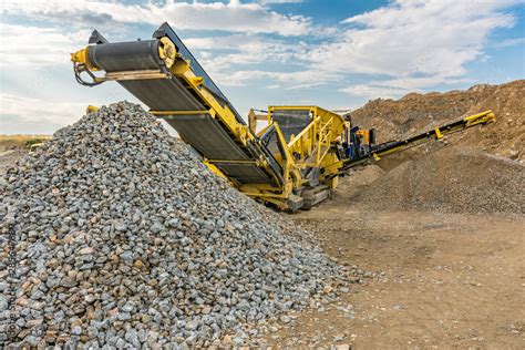 Stone crusher machine in a quarry or open-pit mine, to transform into ...