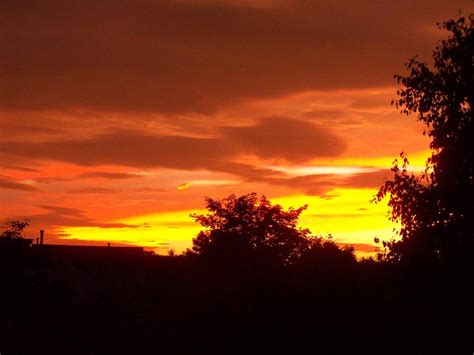 Orange Red And Yellow Sunset Photograph by Corinne Elizabeth Cowherd