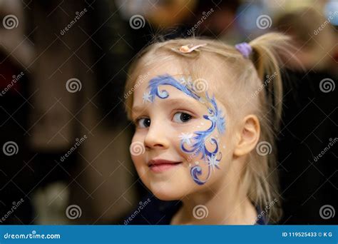 Cute Little Blond Girl with Face Painting. Blue Abstract Snowflake ...