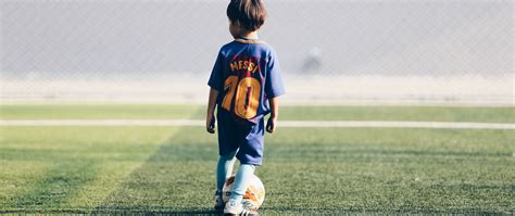 Download wallpaper 2560x1080 child, football player, football, football ...