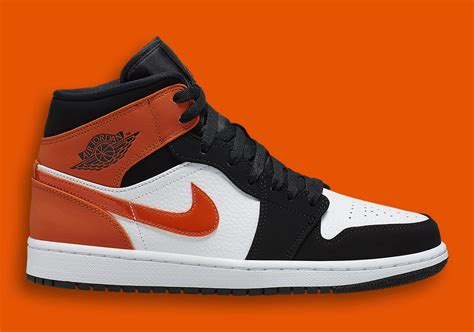 Air Jordan 1 Mid Black White Starfish Orange 554724-058 | SneakerNews.com