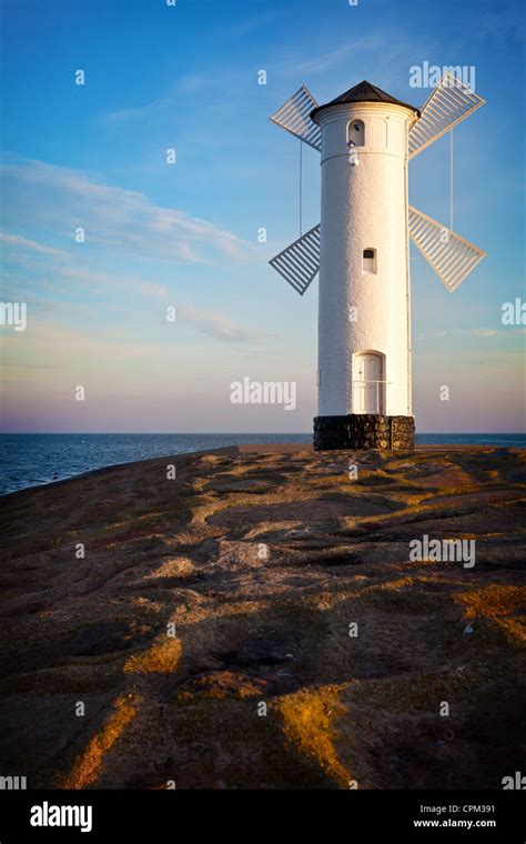 White old lighthouse in Swinoujscie at sunrise, Poland Stock Photo - Alamy