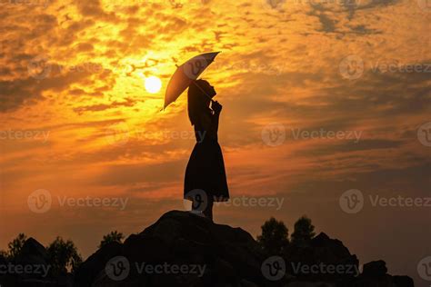 Silhouette sad girl at sunset. 13310613 Stock Photo at Vecteezy