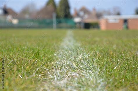 Closeup view of white line on football playground. Detail of a of white ...