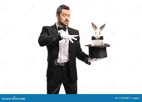 Young Male Magician Making a Magic Trick with a Rabbit in a Top Hat ...