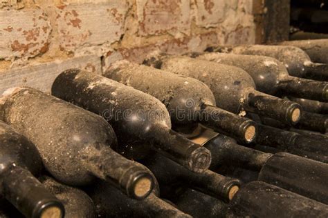 Different Age Wine Bottles on a Shelf Stock Image - Image of distillery ...