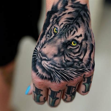 Tattoodo | White tiger tattoo, Tiger hand tattoo, Hand tattoos for guys