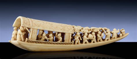 AN IVORY CARVING OF A SAMPAN