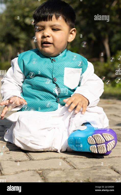 Portrait Of Young Indian Toddler Boy In Ethnic Indian Dress With Funny ...