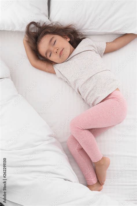 Cute little girl sleeping on cozy bed, view from above Stock Photo ...