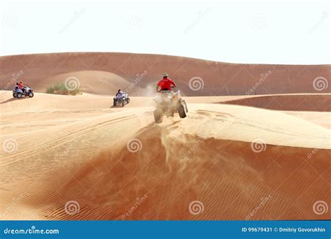 ATV jump on a sand dune editorial photo. Image of jump - 99679431