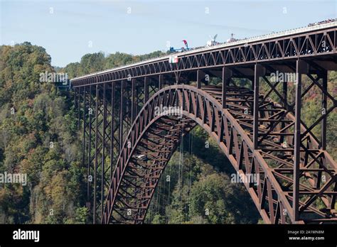 On Bridge Day, crowds pack the New River Gorge Bridge, a steel arch ...