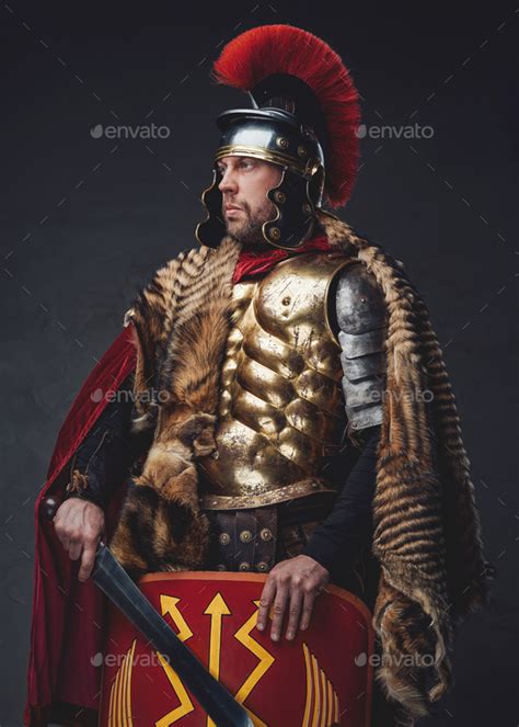 Roman empire soldier posing with sword and shield Stock Photo by fxquadro