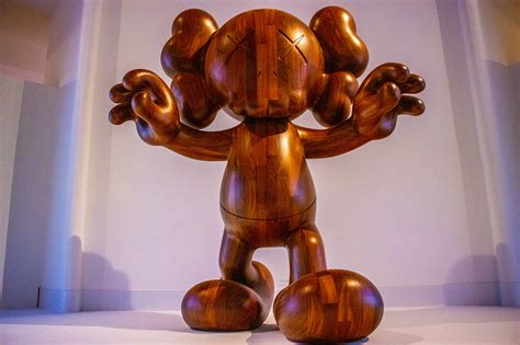 Kaws exhibit on Behance