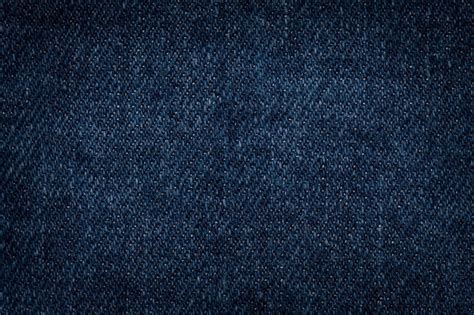 Premium Photo | Dark blue denim background closeup. textured fabric