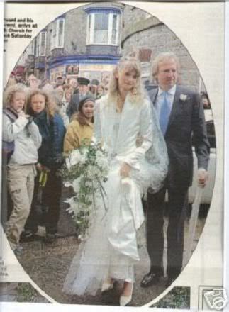 a newspaper article with a bride and groom walking down the street in ...