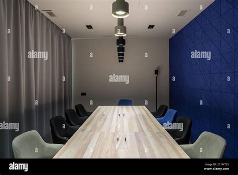 Stylish conference room with gray and blue walls Stock Photo - Alamy