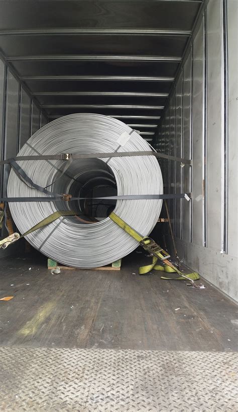 5 Aluminum Rod coils in a van, D hooks in the floor. 39k lbs. 7 straps ...