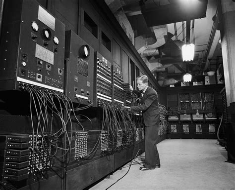 Dr. J.W. Mauchly with the electronic computing machine known as the ...