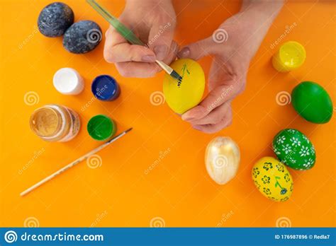 How To Paint Flower on Egg Step 3. Concept of Celebrating Easter. Women ...