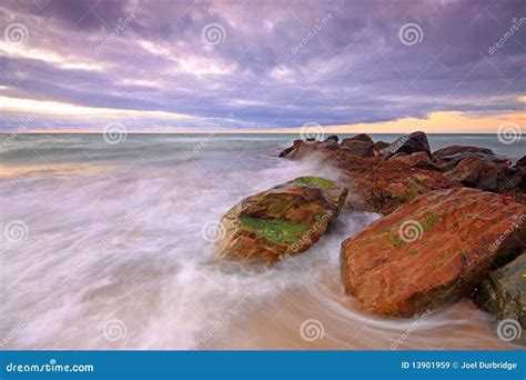 Rocky outcrop stock image. Image of water, overcast, clouds - 13901959