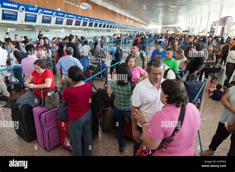 Crowds of people at Guayaquil airport check in; José Joaquín de Olmedo ...