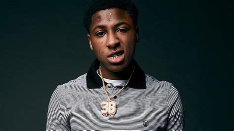 NBA Youngboy Is Wearing Black White Striped T-Shirt In Green Background ...