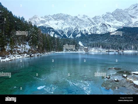 Eibsee lake winter view with thin layer of ice on the surface, Bavaria ...