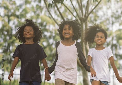 Kids playing with friends. Children African american holding hands ...